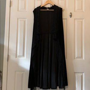 Black sleeveless cover.